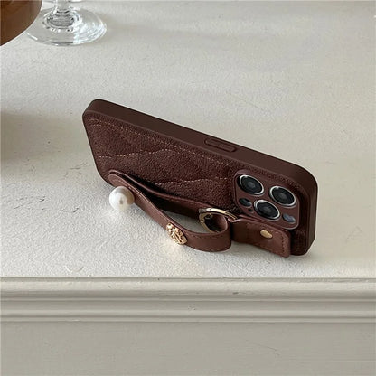 For iPhone 15 Pro Max Wristband Phone Case Down Jacket Design PU Leather + TPU Back Cover
