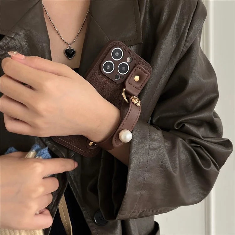 For iPhone 15 Pro Max Wristband Phone Case Down Jacket Design PU Leather + TPU Back Cover