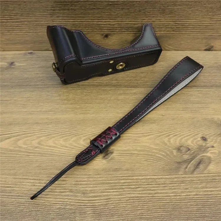 For Canon EOS R50 / R100 PU Leather Bottom Case Half Body Camera Cover with Wrist Strap