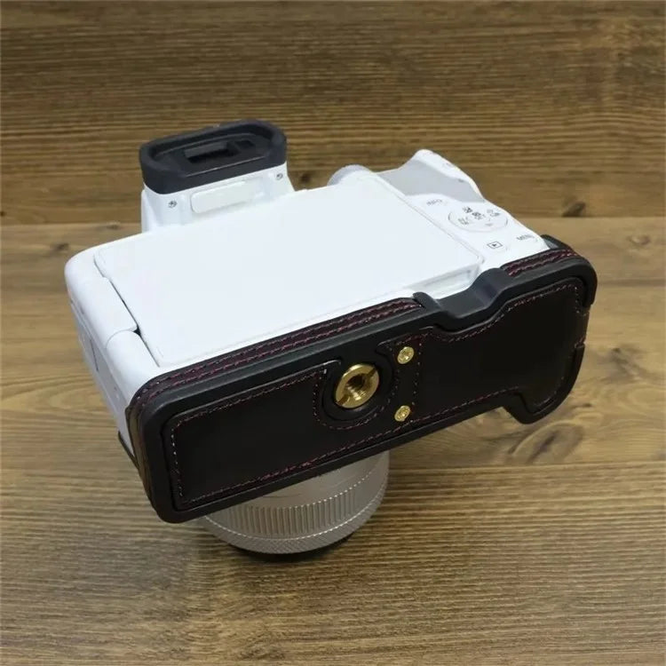 For Canon EOS R50 / R100 PU Leather Bottom Case Half Body Camera Cover with Wrist Strap