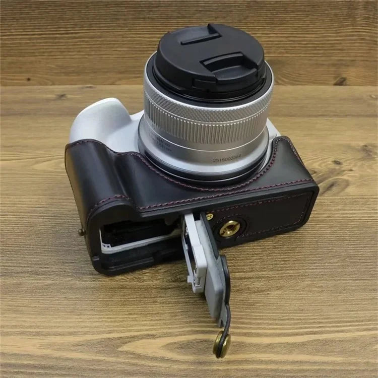 For Canon EOS R50 / R100 PU Leather Bottom Case Half Body Camera Cover with Wrist Strap