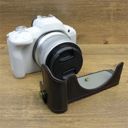 For Canon EOS R50 / R100 PU Leather Bottom Case Half Body Camera Cover with Wrist Strap