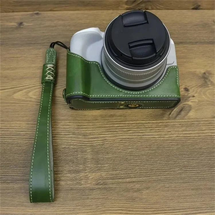 For Canon EOS R50 / R100 PU Leather Bottom Case Half Body Camera Cover with Wrist Strap