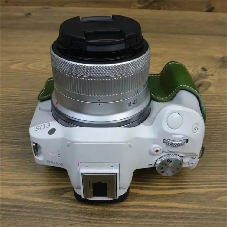 For Canon EOS R50 / R100 PU Leather Bottom Case Half Body Camera Cover with Wrist Strap