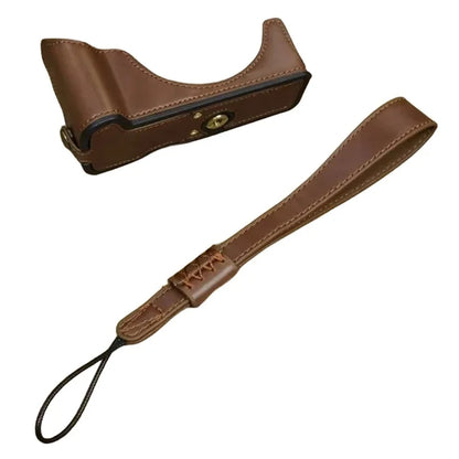 For Canon EOS R50 / R100 PU Leather Bottom Case Half Body Camera Cover with Wrist Strap