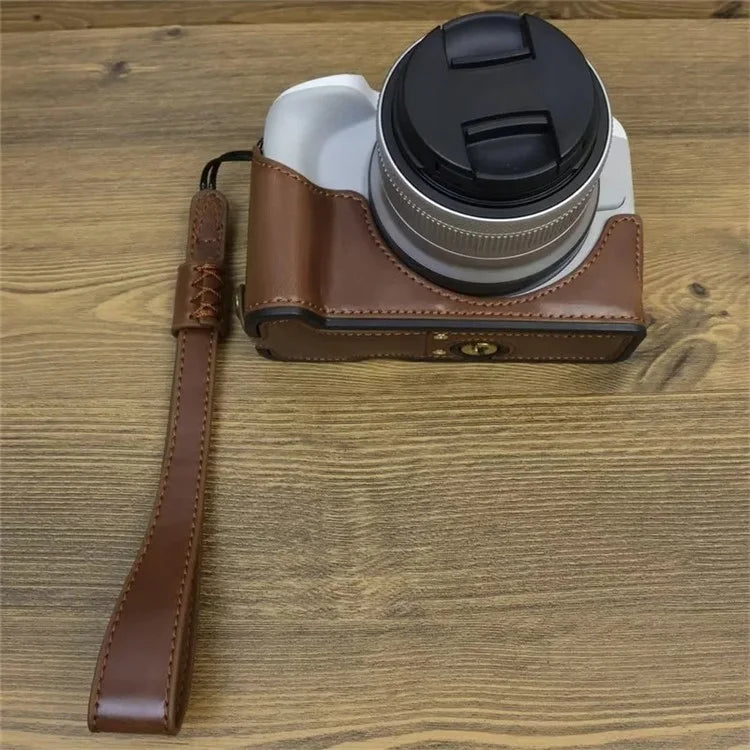 For Canon EOS R50 / R100 PU Leather Bottom Case Half Body Camera Cover with Wrist Strap