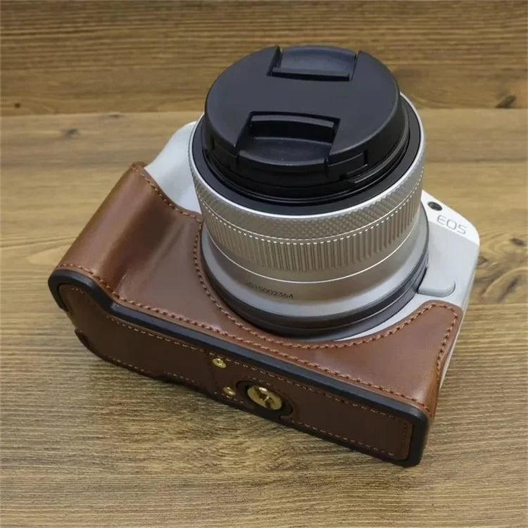 For Canon EOS R50 / R100 PU Leather Bottom Case Half Body Camera Cover with Wrist Strap