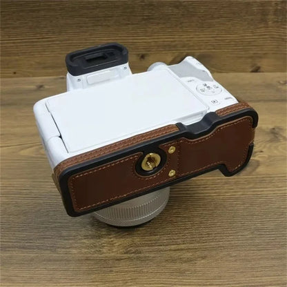 For Canon EOS R50 / R100 PU Leather Bottom Case Half Body Camera Cover with Wrist Strap
