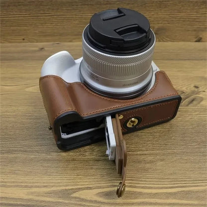 For Canon EOS R50 / R100 PU Leather Bottom Case Half Body Camera Cover with Wrist Strap