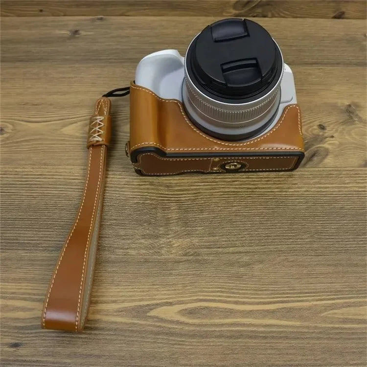 For Canon EOS R50 / R100 PU Leather Bottom Case Half Body Camera Cover with Wrist Strap