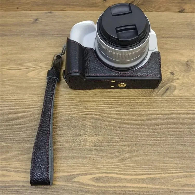 For Canon EOS R50 / R100 Genuine Cow Leather Camera Bottom Case Anti-drop Cover with Wrist Strap