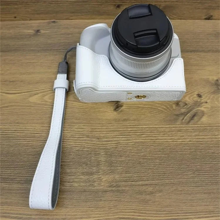 For Canon EOS R50 / R100 Genuine Cow Leather Camera Bottom Case Anti-drop Cover with Wrist Strap