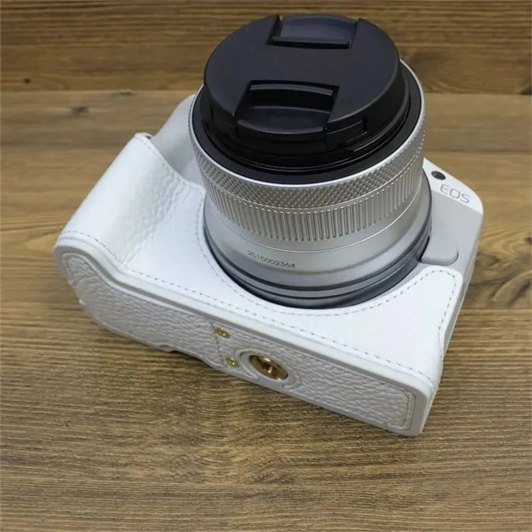 For Canon EOS R50 / R100 Genuine Cow Leather Camera Bottom Case Anti-drop Cover with Wrist Strap