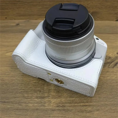 For Canon EOS R50 / R100 Genuine Cow Leather Camera Bottom Case Anti-drop Cover with Wrist Strap