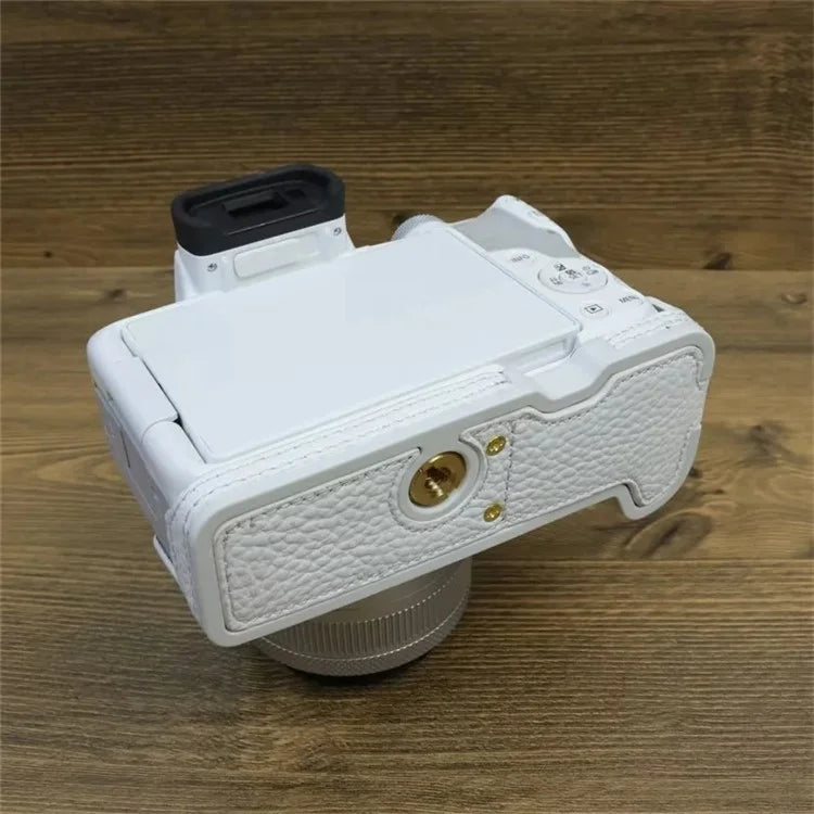 For Canon EOS R50 / R100 Genuine Cow Leather Camera Bottom Case Anti-drop Cover with Wrist Strap