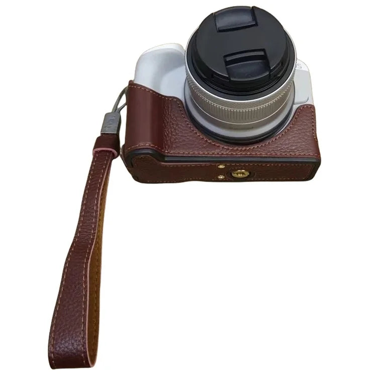 For Canon EOS R50 / R100 Genuine Cow Leather Camera Bottom Case Anti-drop Cover with Wrist Strap