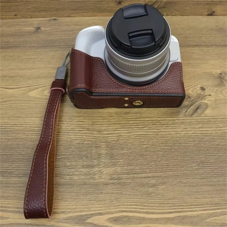 For Canon EOS R50 / R100 Genuine Cow Leather Camera Bottom Case Anti-drop Cover with Wrist Strap