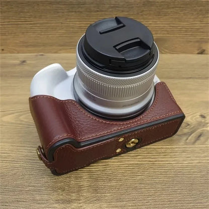 For Canon EOS R50 / R100 Genuine Cow Leather Camera Bottom Case Anti-drop Cover with Wrist Strap
