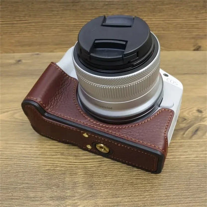 For Canon EOS R50 / R100 Genuine Cow Leather Camera Bottom Case Anti-drop Cover with Wrist Strap