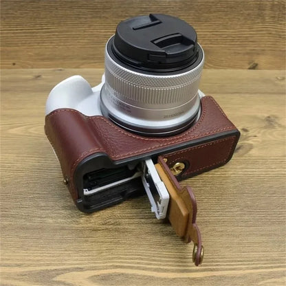 For Canon EOS R50 / R100 Genuine Cow Leather Camera Bottom Case Anti-drop Cover with Wrist Strap