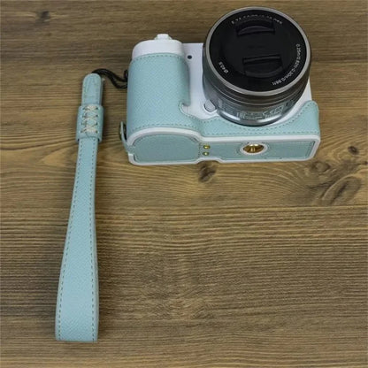 For Sony ZV-E10 PU Leather Bottom Case Battery Opening Design Camera Half Body Cover with Hand Strap