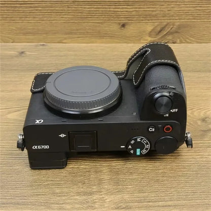 For Sony A6700 Dustproof PU Leather Camera Bottom Cover Half Body Case with Wrist Strap