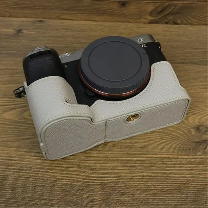 For Sony A7C II Camera Bottom Case PU Leather Anti-drop Half Body Cover with Wrist Strap