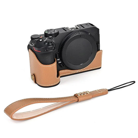 For Nikon Z30 / Z50 Battery Opening Design PU Leather Camera Cover Palm Texture Half Body Bottom Case with Wrist Strap