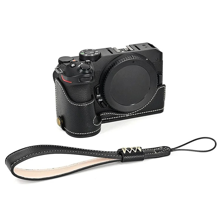 For Nikon Z30 / Z50 Battery Opening Design PU Leather Camera Cover Palm Texture Half Body Bottom Case with Wrist Strap