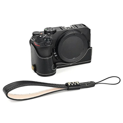 For Nikon Z30 / Z50 Battery Opening Design PU Leather Camera Cover Palm Texture Half Body Bottom Case with Wrist Strap