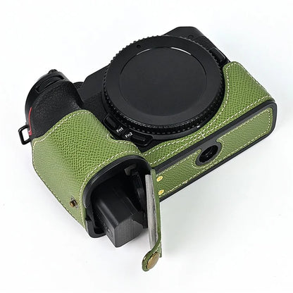 For Nikon Z30 / Z50 Battery Opening Design PU Leather Camera Cover Palm Texture Half Body Bottom Case with Wrist Strap