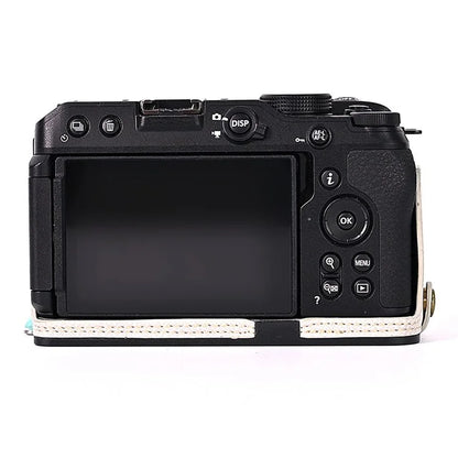 For Nikon Z30 / Z50 Battery Opening Design PU Leather Camera Cover Palm Texture Half Body Bottom Case with Wrist Strap