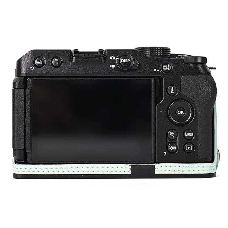 For Nikon Z30 / Z50 Battery Opening Design PU Leather Camera Cover Palm Texture Half Body Bottom Case with Wrist Strap