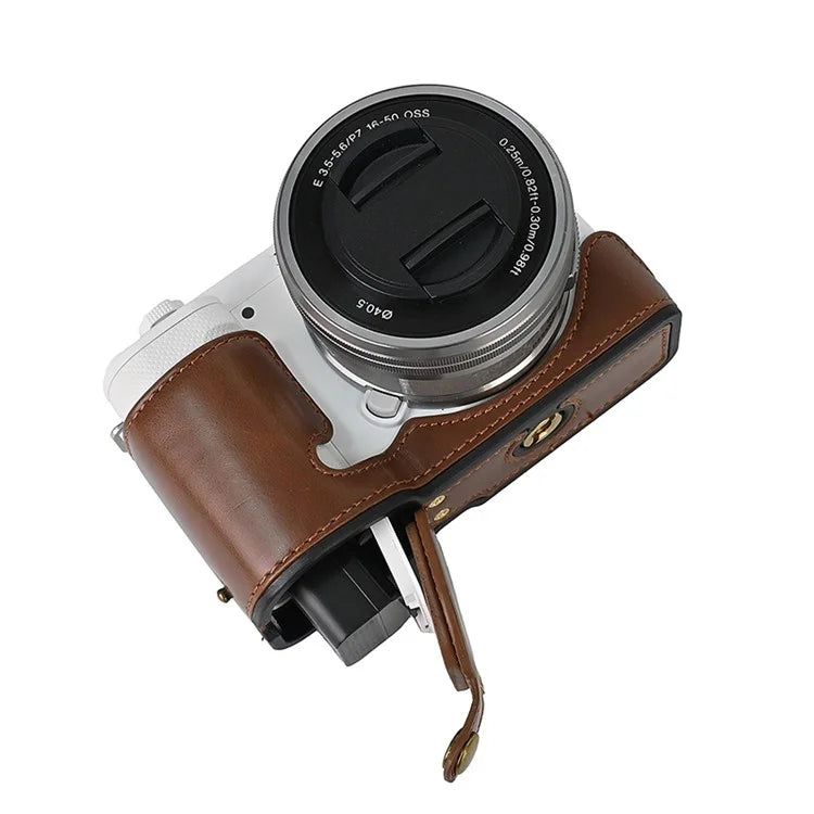 For Sony ZV-E10 Battery Opening Design PU Leather Camera Cover Half Body Bottom Case with Wrist Strap