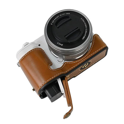 For Sony ZV-E10 Battery Opening Design PU Leather Camera Cover Half Body Bottom Case with Wrist Strap