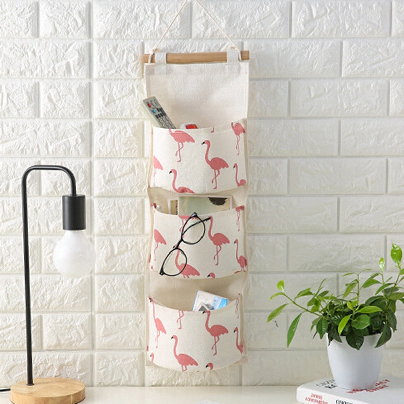 ELECTROPRIME Cotton Linen Hanging Storage Bag 3 Pockets Wall Mounted Wardrobe Hang Bag Wall Pouch Cosmetic Toys Organizer(Green flamingo)